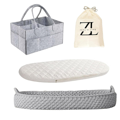 Grey baby changing basket with portable pad and small storage basket